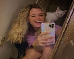Katie is an animal lover and has a cute cat in her home.